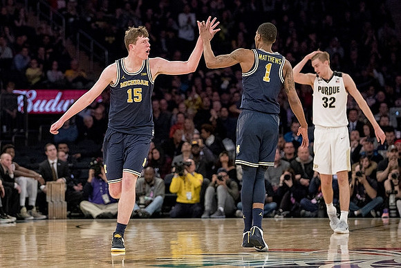 Jon Teske (15) and Charles Matthews (1)