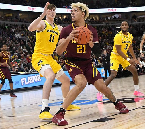 Colin Castleton (11) and Zavier Simpson (3)