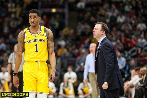 Charles Matthews (1) and Minnesota Head Coach Richard Pitino