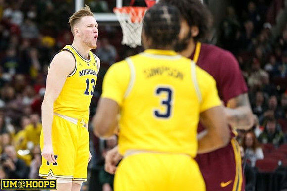 Ignas Brazdeikis (13) and Zavier Simpson (3)