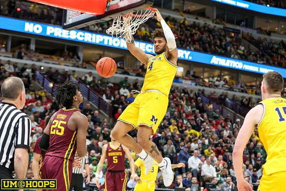 Isaiah Livers (4), Zavier Simpson (3), and Jon Teske (15)