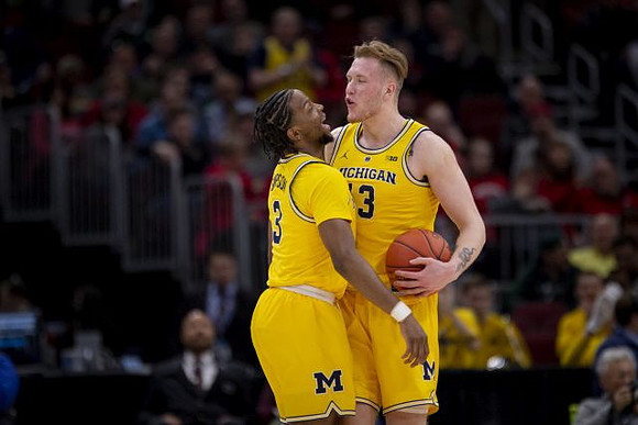 Zavier Simpson (3) and Ignas Brazdeikis (13)
