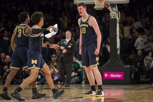 Zavier Simpson (3), Jordan Poole (2), and Jon Teske (15)