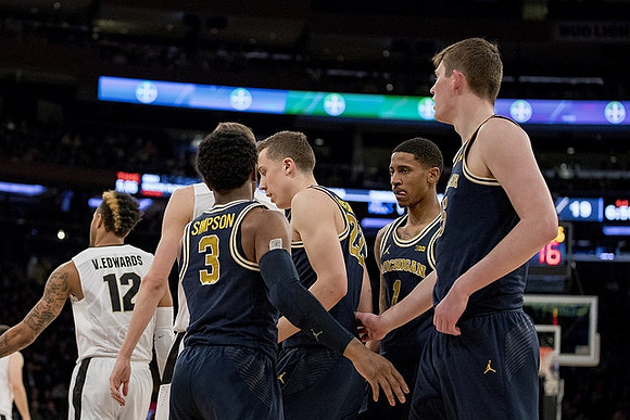 Zavier Simpson (3), Duncan Robinson (22), Charles Matthews (1), and Jon Teske (15)