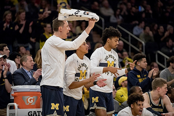 Duncan Robinson (22), Eli Brooks (55), Ibi Watson (23), Jordan Poole (2), and Moritz Wagner (13)