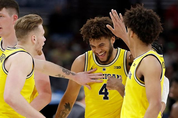 Jon Teske (15), Ignas Brazdeikis (13), Isaiah Livers (4), and Jordan Poole (2)