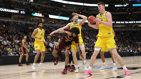 Isaiah Livers (4), Ignas Brazdeikis (13), and Jon Teske (15)