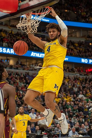 Zavier Simpson (3) and Isaiah Livers (4)