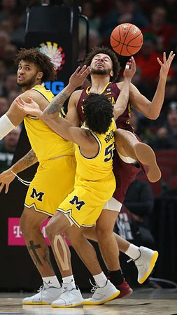 Isaiah Livers (4) and Eli Brooks (55)