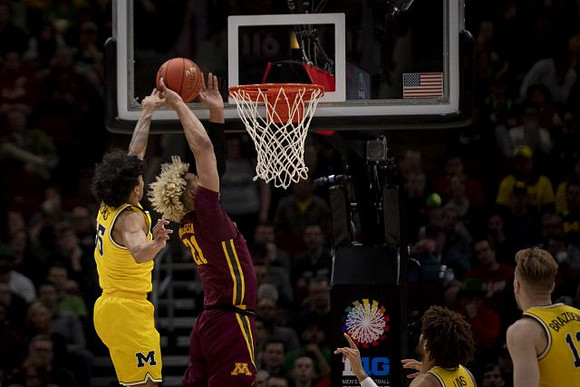 Eli Brooks (55), Isaiah Livers (4), and Ignas Brazdeikis (13)