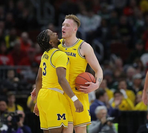 Zavier Simpson (3) and Ignas Brazdeikis (13)
