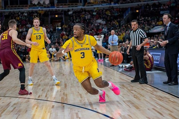 Ignas Brazdeikis (13) and Zavier Simpson (3)
