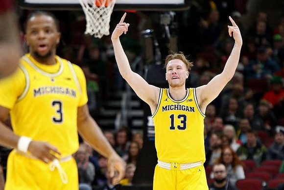 Zavier Simpson (3) and Ignas Brazdeikis (13)