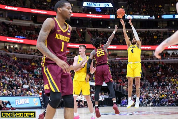 Jon Teske (15) and Isaiah Livers (4)