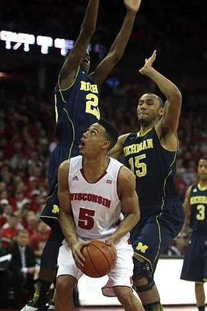 Caris LeVert (23), Jon Horford (15), and Trey Burke (3)