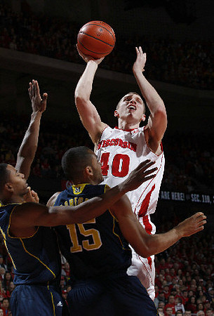 Jon Horford (15) and Trey Burke (3)