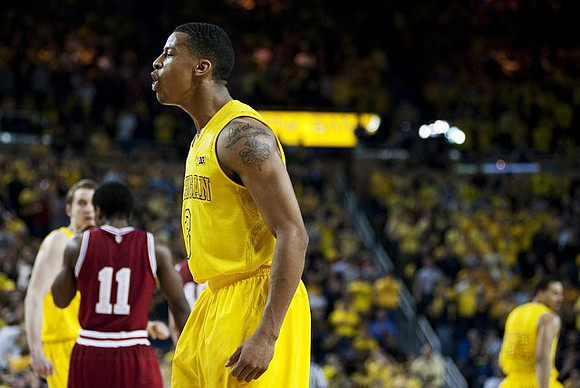 Nik Stauskas (11), Trey Burke (3), and Jordan Morgan (52)