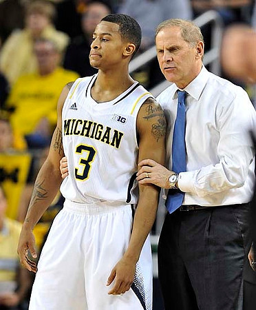 Trey Burke (3) and John Beilein