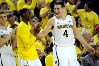 Max Bielfeldt (44), Caris LeVert (23), Mitch McGary (4), and C.J. Lee