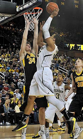 Jordan Morgan (52) and Trey Burke (3)