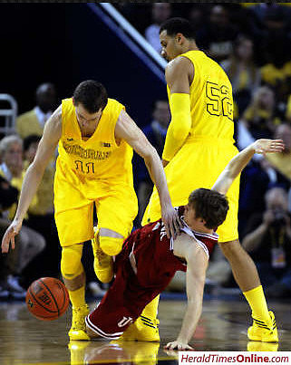Nik Stauskas (11) and Jordan Morgan (52)