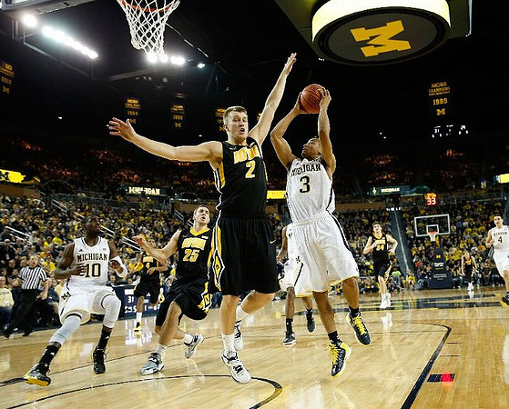 Tim Hardaway Jr. (10), Trey Burke (3), and Mitch McGary (4)