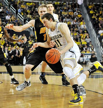 Nik Stauskas (11) and Mitch McGary (4)