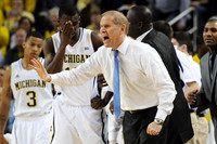 Trey Burke (3), Tim Hardaway Jr. (10), John Beilein, Bacari Alexander, and LaVall Jordan