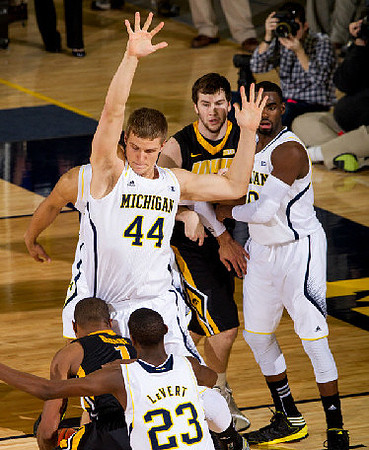 Caris LeVert (23), Max Bielfeldt (44), and Tim Hardaway Jr. (10)