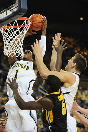 Glenn Robinson III (1) and Mitch McGary (4)