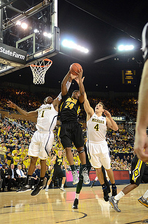 Glenn Robinson III (1) and Mitch McGary (4)
