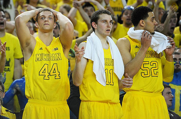 Max Bielfeldt (44), Nik Stauskas (11), and Jordan Morgan (52)