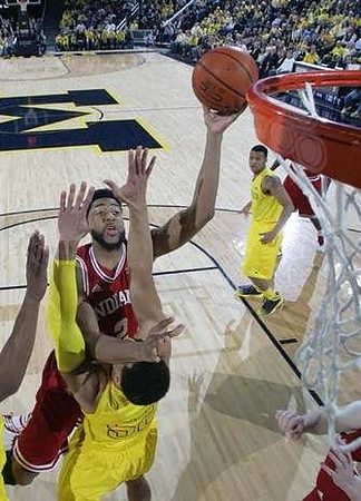 Jordan Morgan (52) and Trey Burke (3)