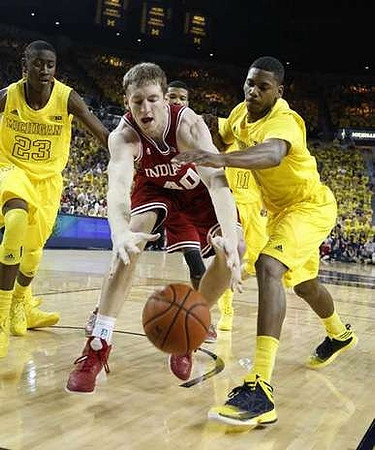 Caris LeVert (23), Glenn Robinson III (1), and Nik Stauskas (11)