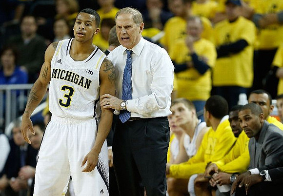 Trey Burke (3) and John Beilein