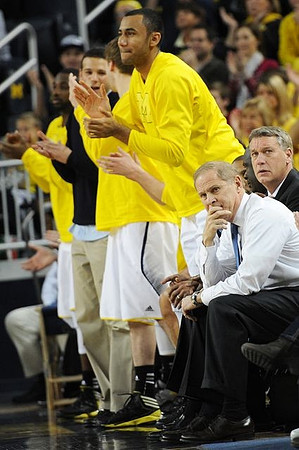 Josh Bartelstein (20), Jon Horford (15), Jeff Meyer, and John Beilein