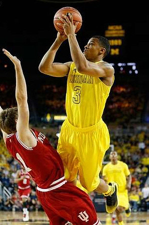Trey Burke (3) and Glenn Robinson III (1)
