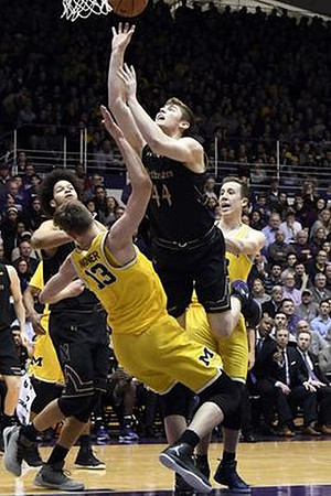 Moritz Wagner (13) and Duncan Robinson (22)