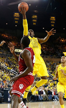 Tim Hardaway Jr. (10) and Jon Horford (15)