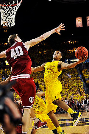 Jordan Morgan (52) and Trey Burke (3)