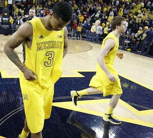 Trey Burke (3) and Spike Albrecht (2)