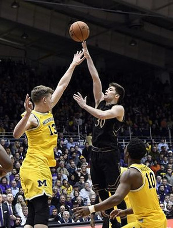 Moritz Wagner (13) and Derrick Walton Jr. (10)