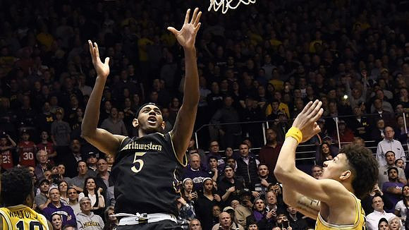 Derrick Walton Jr. (10) and D.J. Wilson (5)