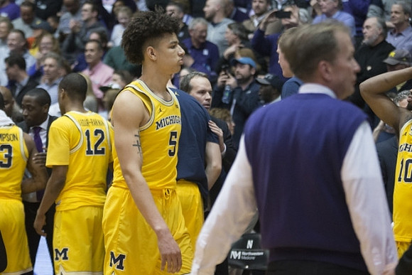 Muhammad-Ali Abdur-Rahkman (12) and D.J. Wilson (5)