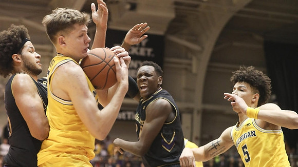 Moritz Wagner (13) and D.J. Wilson (5)