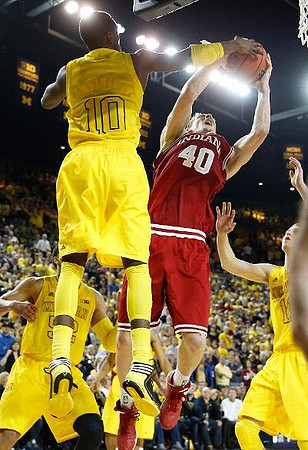 Tim Hardaway Jr. (10), Jordan Morgan (52), and Nik Stauskas (11)