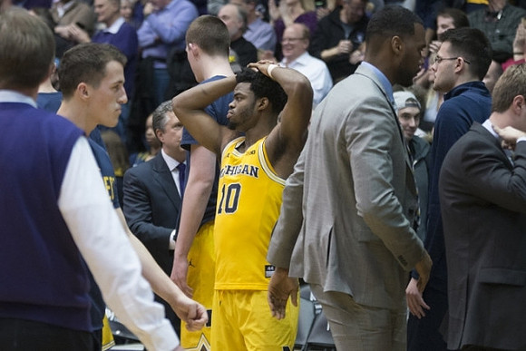 Andrew Dakich (11) and Derrick Walton Jr. (10)