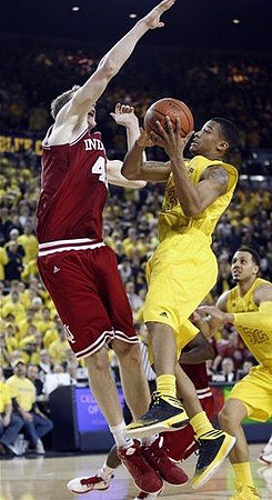 Trey Burke (3) and Jordan Morgan (52)