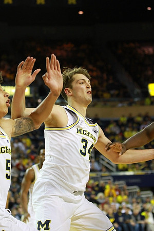 D.J. Wilson (5) and Mark Donnal (34)