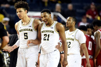 D.J. Wilson (5), Zak Irvin (21), and Muhammad-Ali Abdur-Rahkman (12)